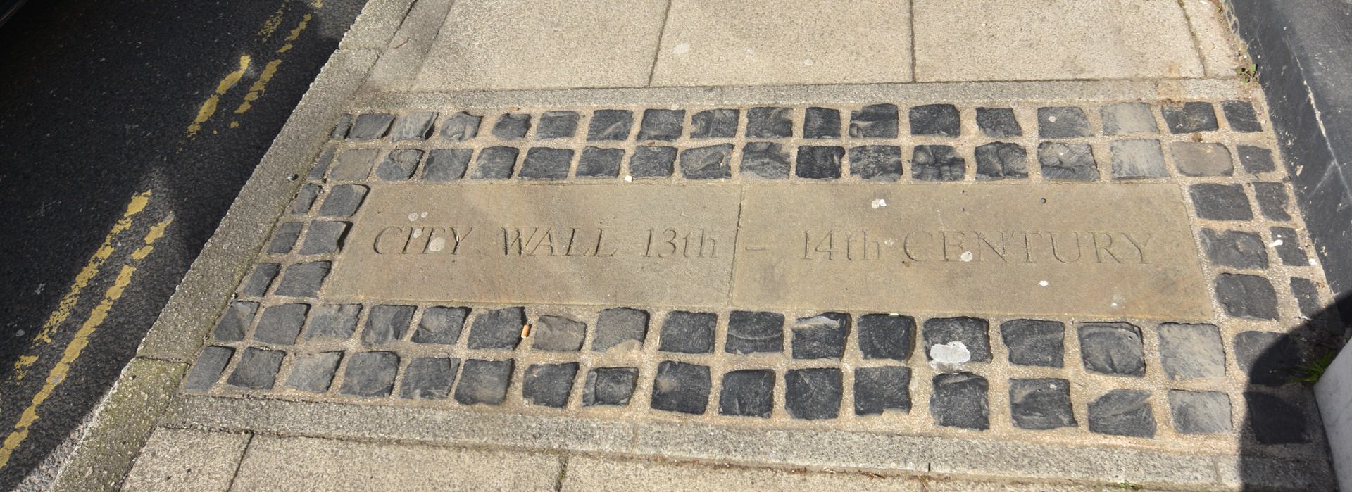 City wall marker on pavement of St. Augustines Street